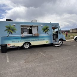 a food truck in a parking lot a food truck in a parking lot
