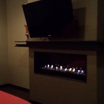 Belamere Suites - Bed by fire light - Hotels Near Me - Perrysburg, Ohio Belamere Suites - Bed by fire light - Hotels Near Me - Perrysburg, Ohio