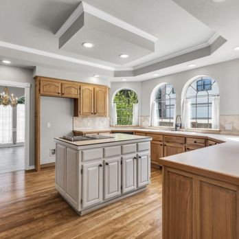 Lawrence Welch Construction - a kitchen with hardwood floors - General Contractors Near Me