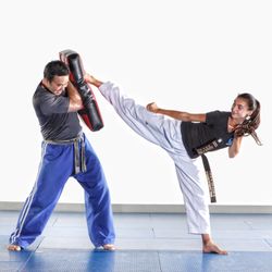 Masters Martial Arts - Powerful kicks from our black belts teens. She started out as a white belt but now kicks with black belt power and confidence.
