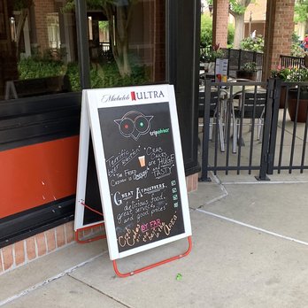 The Corner Stable - Sign outside and part of the outdoor eating area - Barbeque Near Me - Columbia, Maryland
