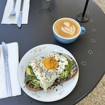 Mom 'n 'em Coffee & Wine - Avocado toastie with an egg + an oat cappuccino with cinnamon - Coffee & Tea Near Me - Cincinnati, Ohio Mom 'n 'em Coffee & Wine - Avocado toastie with an egg + an oat cappuccino with cinnamon - Coffee & Tea Near Me - Cincinnati, Ohio