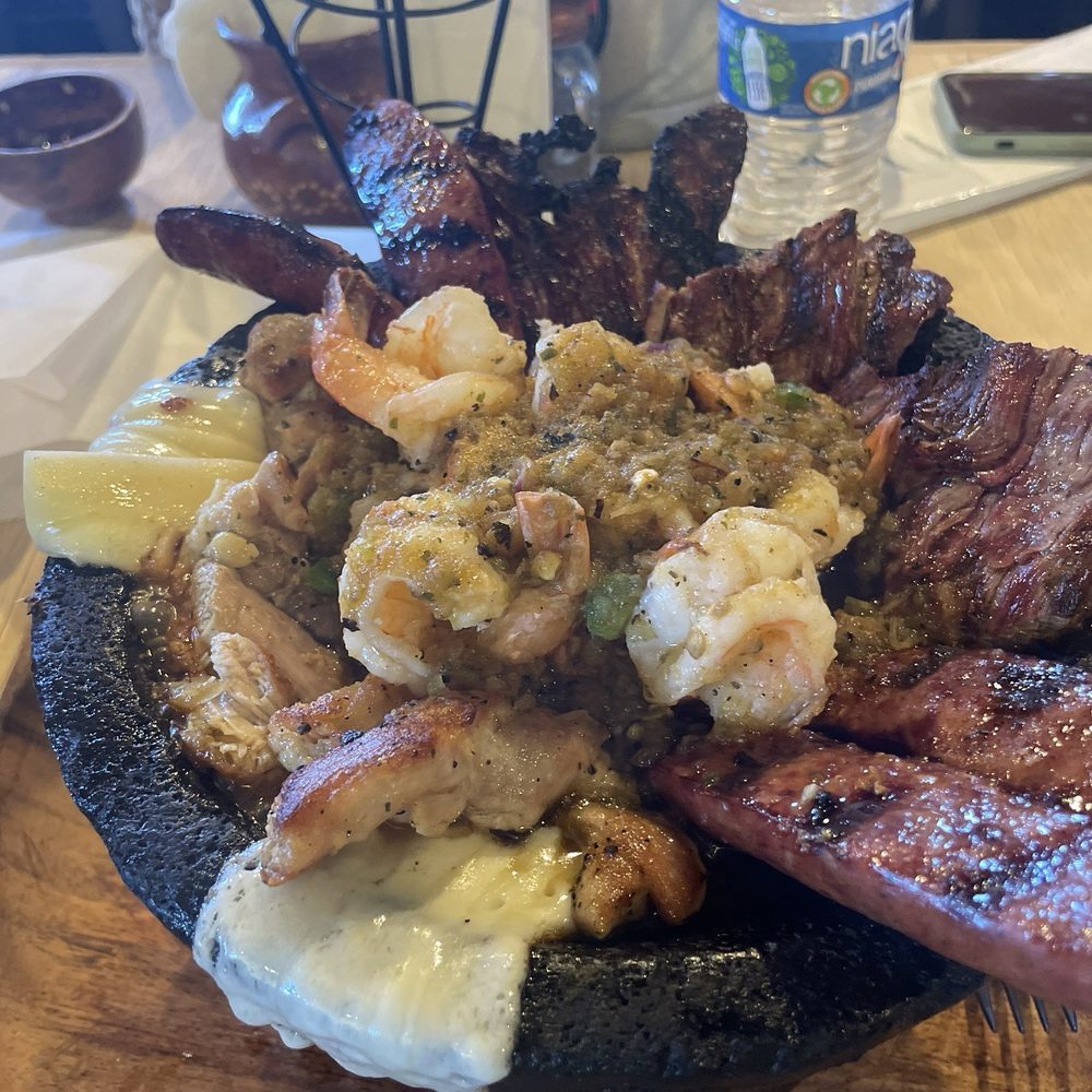 Mariscos El Buchon - Molcajete w/ shrimp, steak, chicken, cheese and chorizo dish - Seafood Near Me - Carlsbad, New Mexico Mariscos El Buchon - Molcajete w/ shrimp, steak, chicken, cheese and chorizo dish - Seafood Near Me - Carlsbad, New Mexico