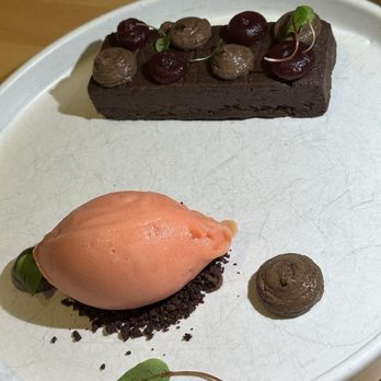 Solstice - Blood orange sorbet with a flourless chocolate cake - New American Near Me - Irvine, California Solstice - Blood orange sorbet with a flourless chocolate cake - New American Near Me - Irvine, California