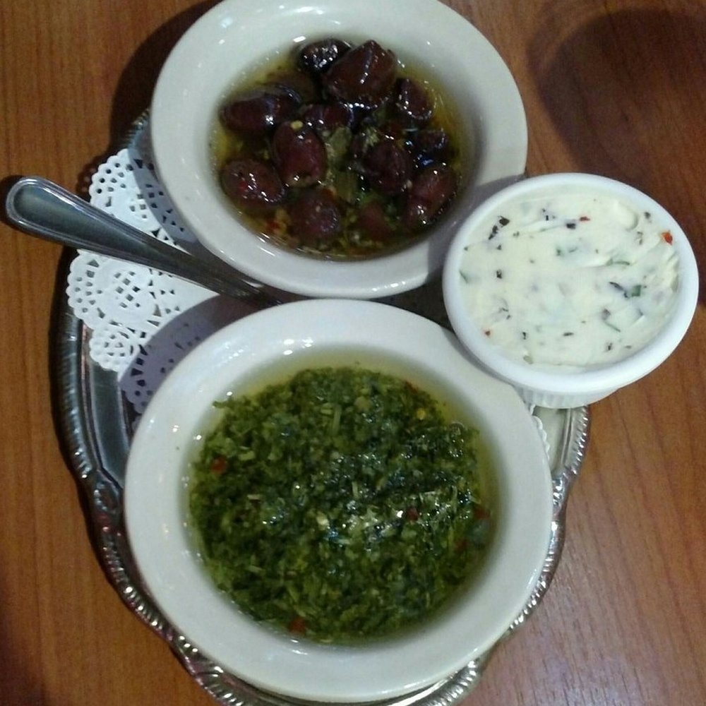 Puerto La Boca - Olives, chimichurri, and chive butter - Steakhouses Near Me - San Diego, California Puerto La Boca - Olives, chimichurri, and chive butter - Steakhouses Near Me - San Diego, California