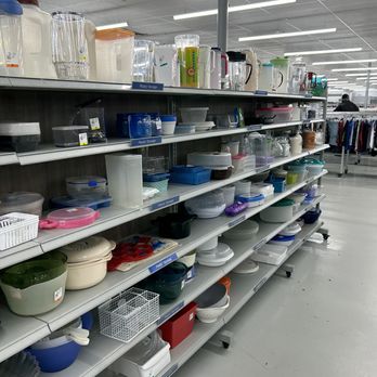 2nd Ave Thrift Superstore - A retail aisle displays shelves filled with plastic storage containers, bowls, and kitchenware, organized for sale in a thrift store. - Thrift Stores Near Me - Union, New Jersey