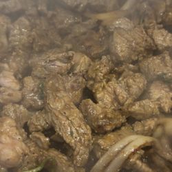 Bomburrito - Asada on the grill sizzling