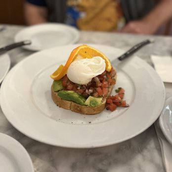 Immigrant Son Caffe - Avocado toast topped with a poached egg - New American Near Me - Ventura, California Immigrant Son Caffe - Avocado toast topped with a poached egg - New American Near Me - Ventura, California