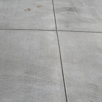 AAA Builders - Browns spots left on cement by contractors own vehicle - General Contractors Near Me