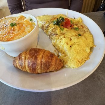 Whisk Breakfast & Brunch - Vegan Egg made into an omelette with a side of cheese grits and a honey butter croissant - Breakfast & Brunch Near Me - East Point, Georgia Whisk Breakfast & Brunch - Vegan Egg made into an omelette with a side of cheese grits and a honey butter croissant - Breakfast & Brunch Near Me - East Point, Georgia