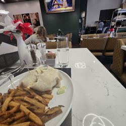 The Brass Lantern - Chicken ceaser wrap and seasoned fries.