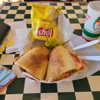 Capo’s Pizzeria Babcock - Homemade meatball and cheese sub, chips (no choice was given) and 2 banana peppers.  Unsweetened tea. - Pizza Near Me - San Antonio, Texas