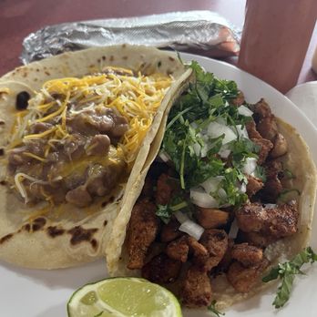 Yoli's Tacos Y Mas - Guisado, bean and cheese taco on flour and Al Pastor taco on corn - Mexican Near Me - Bastrop, Texas Yoli's Tacos Y Mas - Guisado, bean and cheese taco on flour and Al Pastor taco on corn - Mexican Near Me - Bastrop, Texas