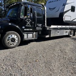 Tic Tac Towing - Tow truck with our travel trailer on it