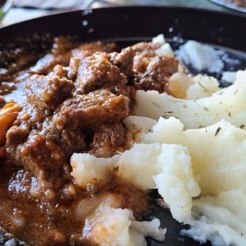 Two Brothers Cafe and Grill - GOULASH-Hungarian braised beef with vegetables and mashed potatoes. (Half consumed in pic) - SO GOOD! - Mediterranean Near Me - Portland, Oregon Two Brothers Cafe and Grill - GOULASH-Hungarian braised beef with vegetables and mashed potatoes. (Half consumed in pic) - SO GOOD! - Mediterranean Near Me - Portland, Oregon