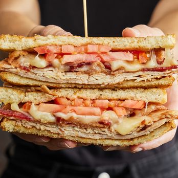 The Big Biscuit - a person holding a sandwich - Diners Near Me - Mission, Kansas The Big Biscuit - a person holding a sandwich - Diners Near Me - Mission, Kansas