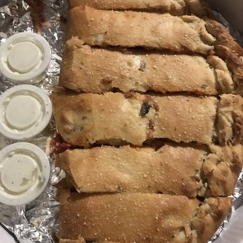 Vesuvio Pizza - a large piece of pizza in a box - Pizza Near Me - Elkhart, Indiana Vesuvio Pizza - a large piece of pizza in a box - Pizza Near Me - Elkhart, Indiana