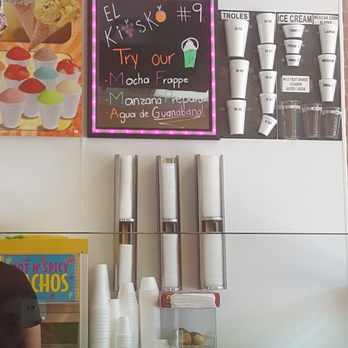 El Kiosko - a woman at a counter - Desserts Near Me - Houston, Texas