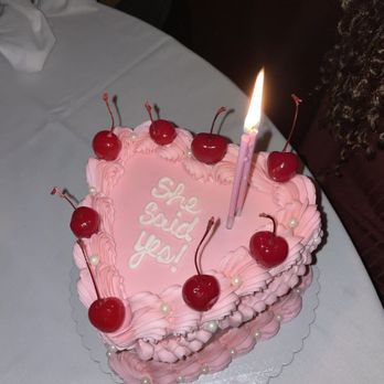 Two Crazy Bakers - a heart shaped cake with a candle - Bakeries Near Me - Murphy, Texas