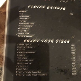 Mistico - Blurry menu pic of hookah price and flavors - Restaurants Near Me - Tulum, ROO