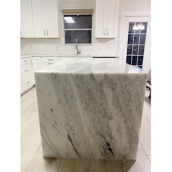 New Edge Stone - a kitchen counter with a marble top - Countertop Installation Near Me - Houston, Texas