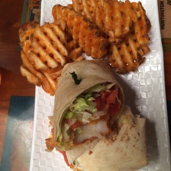 Shark Pit Bar & Grill - Bang Bang Shrimp Wrap with Waffle Fries - New American Near Me - Cocoa Beach, Florida Shark Pit Bar & Grill - Bang Bang Shrimp Wrap with Waffle Fries - New American Near Me - Cocoa Beach, Florida