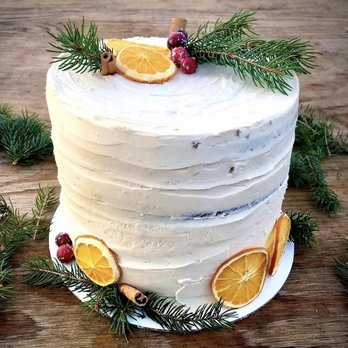 Glitter Thicket - a white frosted cake with orange slices - Vegan Near Me - Nyack, New York Glitter Thicket - a white frosted cake with orange slices - Vegan Near Me - Nyack, New York