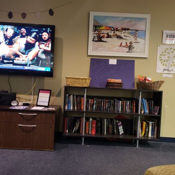 USO - a living room with a flat screen tv - Airport Lounges Near Me - Pensacola, Florida USO - a living room with a flat screen tv - Airport Lounges Near Me - Pensacola, Florida