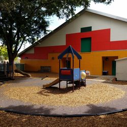Homestead Family YMCA Preschool - West play area. Preschool building with new paint job.