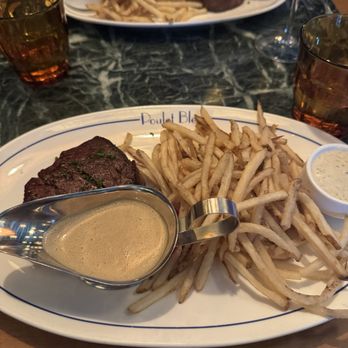 Poulet Bleu - Filet mignon and frites with cognac peppercorn sauce and truffle sauce for the fries - French Near Me - Pittsburgh, Pennsylvania Poulet Bleu - Filet mignon and frites with cognac peppercorn sauce and truffle sauce for the fries - French Near Me - Pittsburgh, Pennsylvania