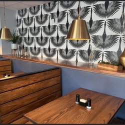 The Goose Eatery & Hangout - Trendy booth tables and decor