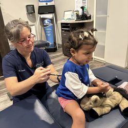 Pleasant Hill Family Chiropractic - Dr. Savion adjusting a child using low force activator instrument.