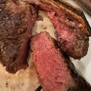 Halls Chophouse - Perfectly cooked medium rare Dry Aged Bone In Kansas City Cut - Steakhouses Near Me - Charleston, South Carolina Halls Chophouse - Perfectly cooked medium rare Dry Aged Bone In Kansas City Cut - Steakhouses Near Me - Charleston, South Carolina