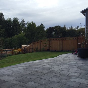 Pacific Landscaping - Curved back patio made with concrete pavers because straight would be too easy for Hieu. - Landscaping Near Me - Kent, Washington Pacific Landscaping - Curved back patio made with concrete pavers because straight would be too easy for Hieu. - Landscaping Near Me - Kent, Washington