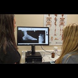Palm City Podiatry - (left) Dr. Blanchet and Dr. Tendrich review digital x-rays taken in office