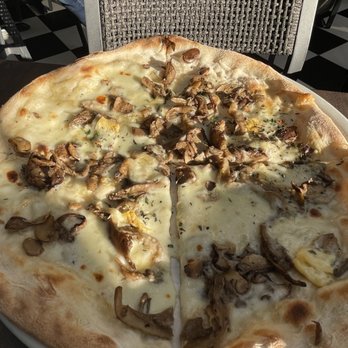 Trattoria Nervosa - Funghi (mushroom) Pizza - roasted mushrooms, fior di latte, fontina, taleggio, thyme. - Italian Near Me - Toronto, Ontario Trattoria Nervosa - Funghi (mushroom) Pizza - roasted mushrooms, fior di latte, fontina, taleggio, thyme. - Italian Near Me - Toronto, Ontario