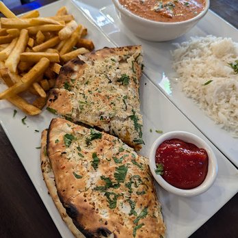 Parivaar Pub - Chicken Tikka Taco and Masala Fries. Kashmiri Chicken with rice was super delicious. - Indian Near Me - Buffalo, New York
