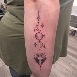 Cry Babies Tattoo - Fine-line celestial work with clean, delicate linework and detailed elements.