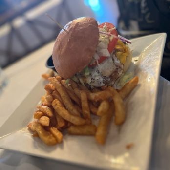 Osphere Grill and Bar - Breakfast type burger with a fried egg . Portion was huge - very good . - American Near Me - Orlando, Florida