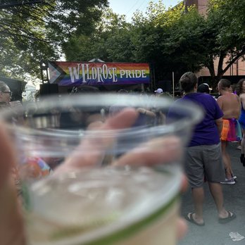 Wildrose - a person holding a glass of beer - Gay Bars Near Me - Seattle, Washington Wildrose - a person holding a glass of beer - Gay Bars Near Me - Seattle, Washington