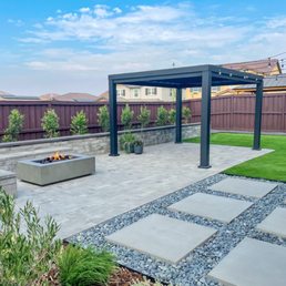 a patio with a fire pit