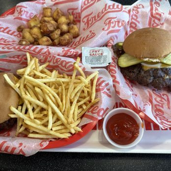 Freddy's Frozen Custard & Steakburgers - Two Freddy's Original Doubles, fries and Cheese Curds - Burgers Near Me - Bryan, Texas Freddy's Frozen Custard & Steakburgers - Two Freddy's Original Doubles, fries and Cheese Curds - Burgers Near Me - Bryan, Texas