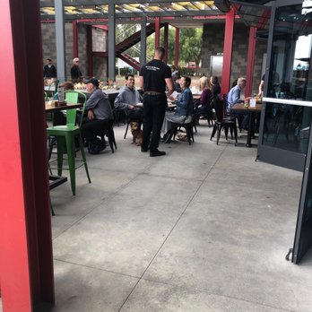 Eureka! - Outside patio with games and some dogs - American Near Me - Carlsbad, California