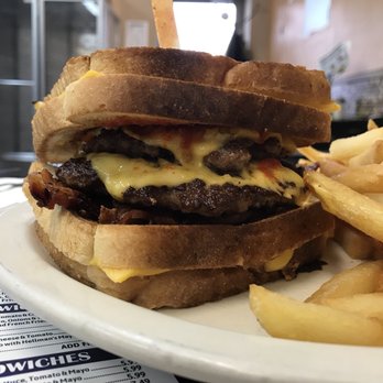 Sunshine Grill - The Volcano: a fresh ground double patty cheeseburger Sandwiched between 2 grilled cheese sandwiches and fries $11 - Breakfast & Brunch Near Me - Edison, New Jersey Sunshine Grill - The Volcano: a fresh ground double patty cheeseburger Sandwiched between 2 grilled cheese sandwiches and fries $11 - Breakfast & Brunch Near Me - Edison, New Jersey