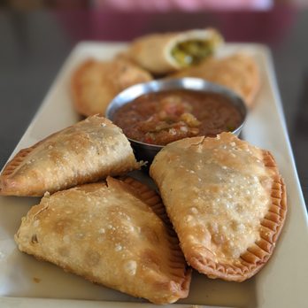Ada's Gojjo - a plate of empanadas with dipping sauce - Ethiopian Near Me - Asbury Park, New Jersey Ada's Gojjo - a plate of empanadas with dipping sauce - Ethiopian Near Me - Asbury Park, New Jersey