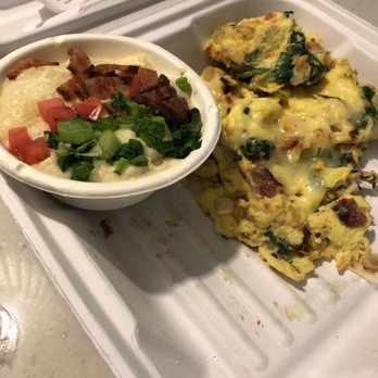 Another Broken Egg Cafe - Sunrise scramble with grits (cheese, Green onions, bacon topped). Eyes were dry and chewy - American Near Me - Raleigh, North Carolina Another Broken Egg Cafe - Sunrise scramble with grits (cheese, Green onions, bacon topped). Eyes were dry and chewy - American Near Me - Raleigh, North Carolina