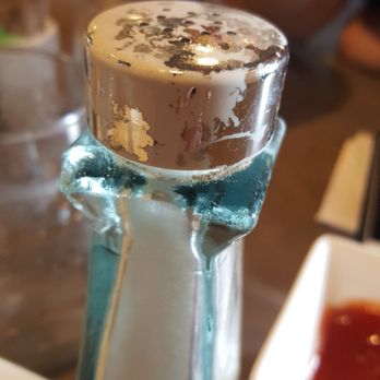 Moena Café - Why wouldn't they remove old salt shaker from the table if the lid had silver flakes coming off. - Cafes Near Me - Honolulu, Hawaii Moena Café - Why wouldn't they remove old salt shaker from the table if the lid had silver flakes coming off. - Cafes Near Me - Honolulu, Hawaii