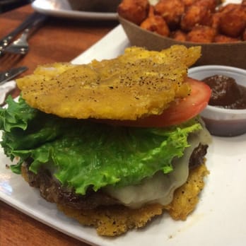 PINCHO - Up close Tostón Burger. About the size of a whopper junior - Latin American Near Me - Pembroke Pines, Florida PINCHO - Up close Tostón Burger. About the size of a whopper junior - Latin American Near Me - Pembroke Pines, Florida
