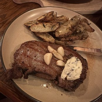 Spaghetti Western - RIBEYE STEAK & POTATOES - Pan seared boneless ribeye served with a side of oven roasted garlic & rosemary potatoes - Italian Near Me - Morongo Valley, California Spaghetti Western - RIBEYE STEAK & POTATOES - Pan seared boneless ribeye served with a side of oven roasted garlic & rosemary potatoes - Italian Near Me - Morongo Valley, California