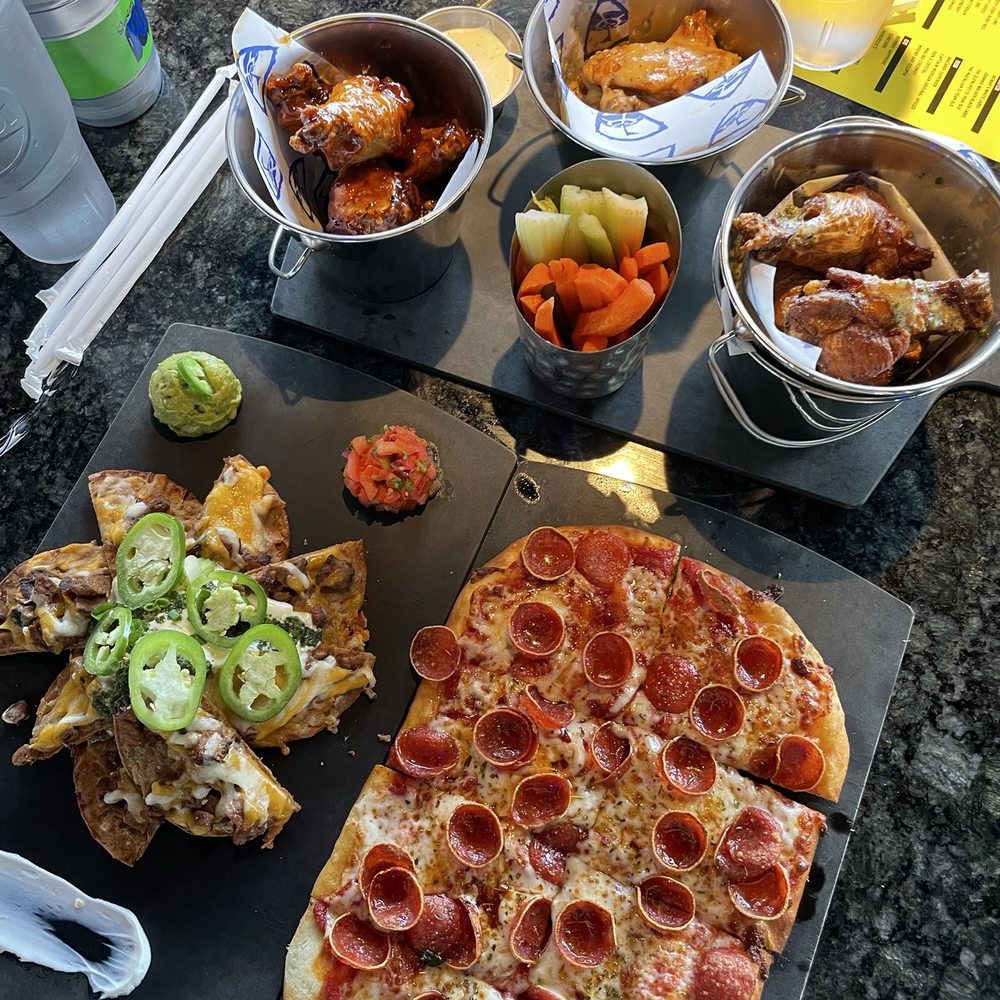 Topgolf - Nacho average nachos, wing trio (asian sesame, garlic parmesan, lemon pepper) , hot honey pepperoni flatbread - Golf Near Me - Montebello, California Topgolf - Nacho average nachos, wing trio (asian sesame, garlic parmesan, lemon pepper) , hot honey pepperoni flatbread - Golf Near Me - Montebello, California